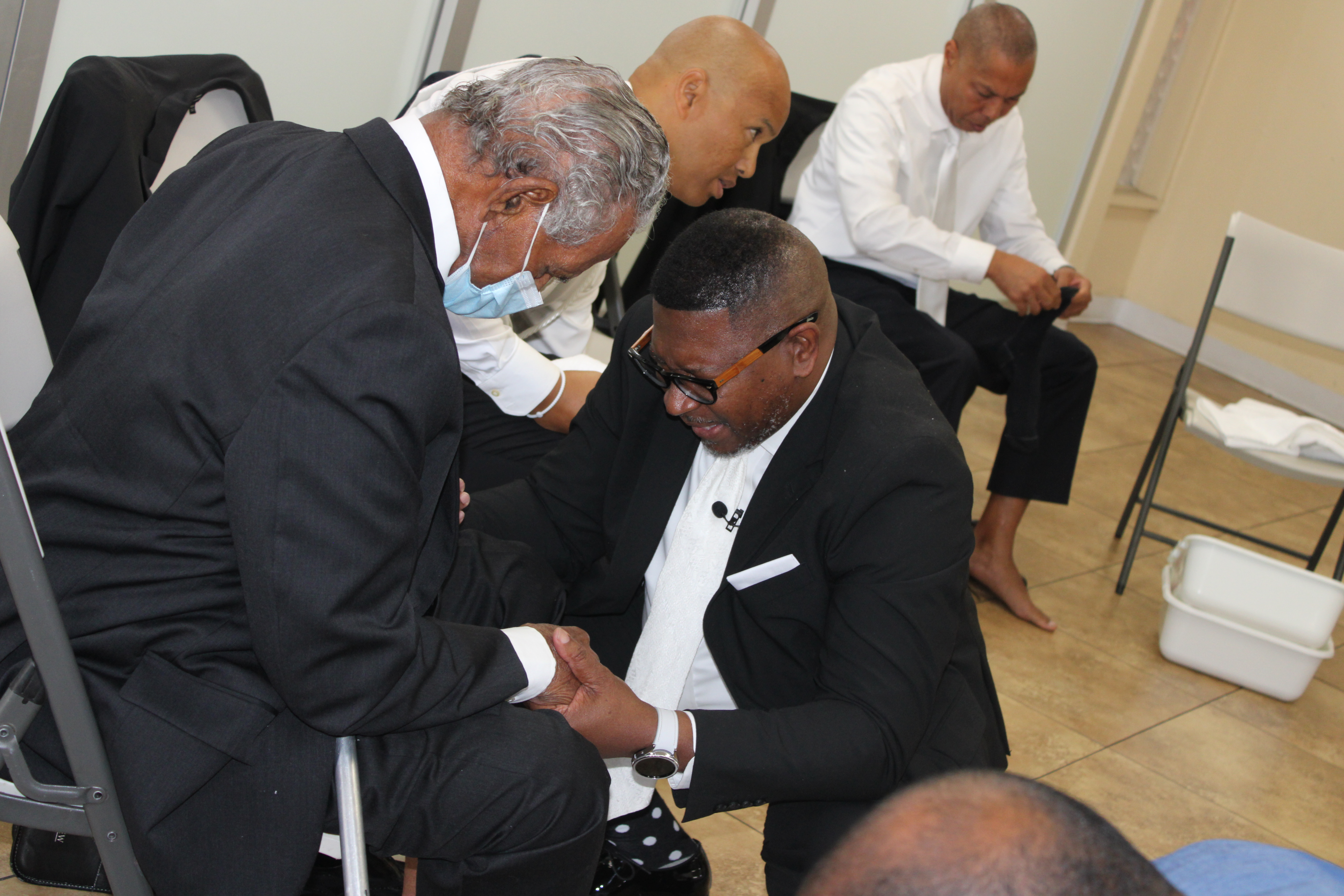 Dr. Roscoe Shields Jr. engaging warmly with church members and community leaders during fellowship