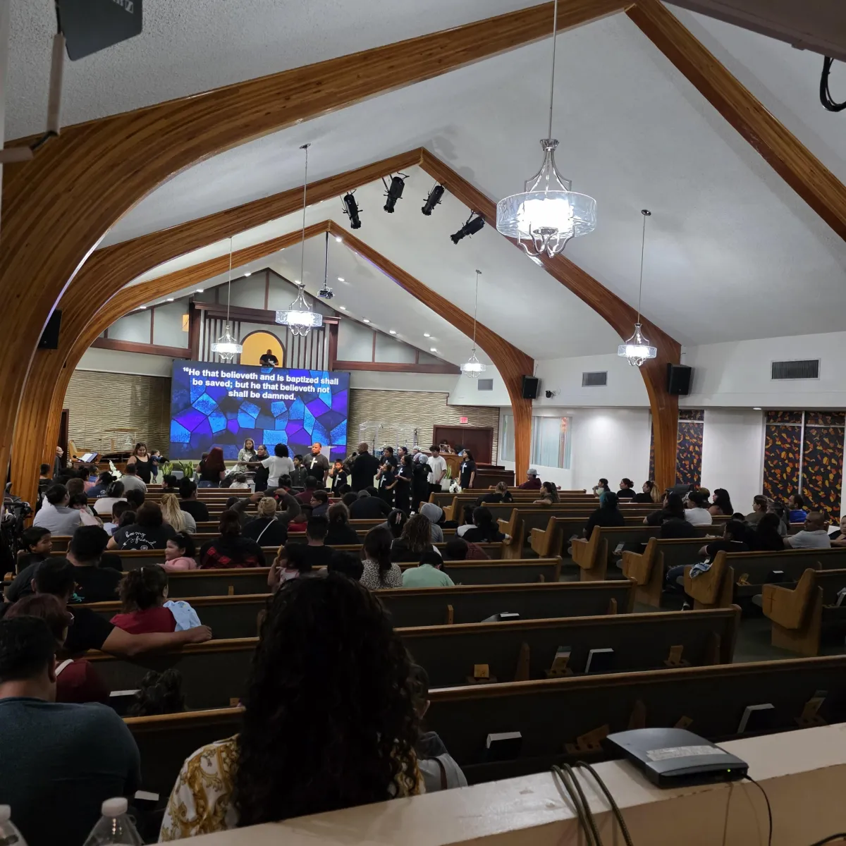 Warm community members gathered together in an inviting atmosphere at Valley Crossroads