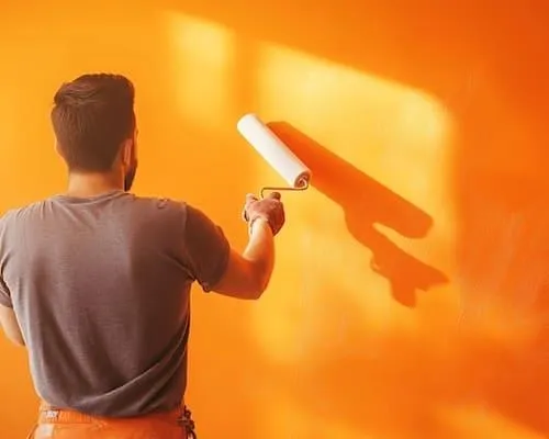 Painter painting wall