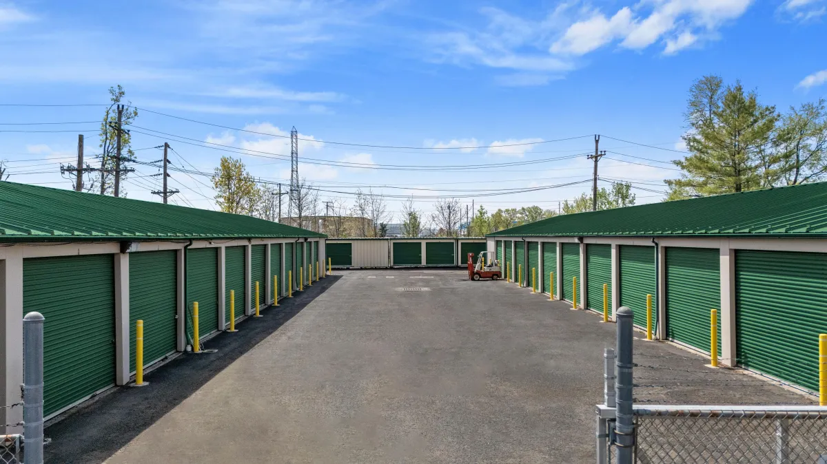 A metal box with a gun on top of it