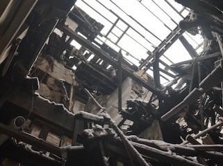 Collapsed rear bay roof framing inside 2900 Cass