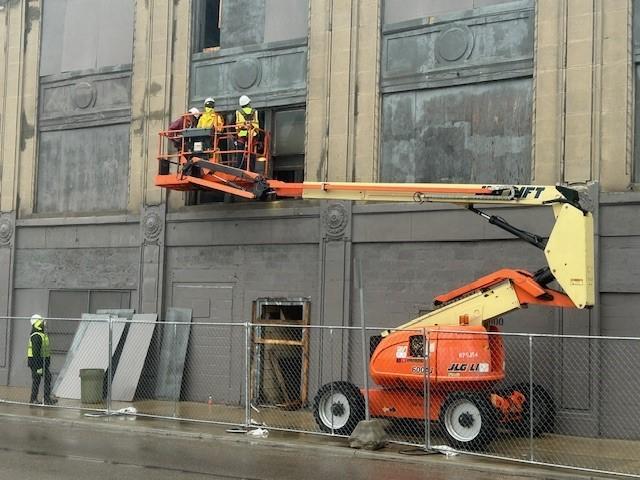 JC Beal crew on lifts inspecting windows on the 2900 Cass façade
