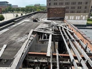 Damaged roof structure at 2900 Cass during inspection