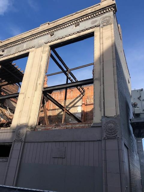 Corner of the 2900 Cass façade with steel framing visible