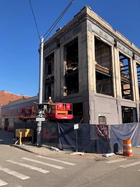 Corner view of the braced 2900 Cass façade at Cass and Temple