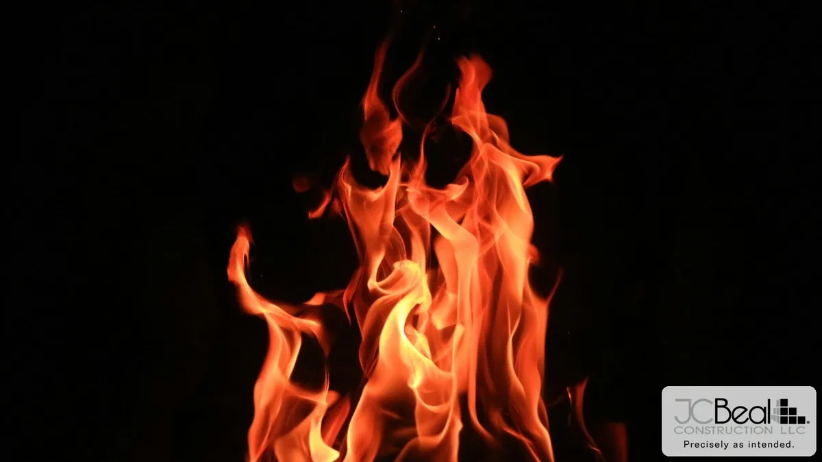 Close-up of orange flames against a dark background