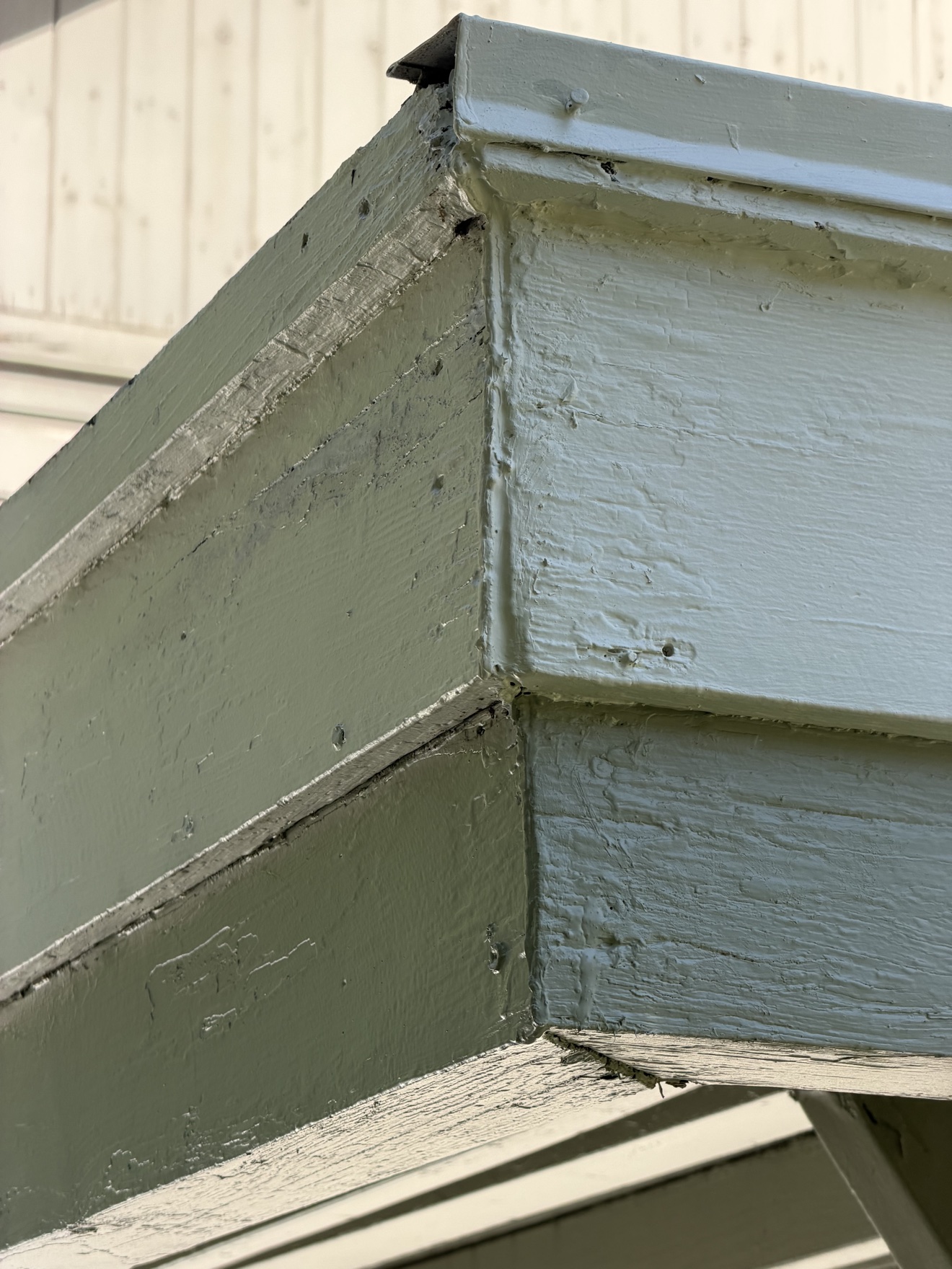Close-up of freshly painted fascia boards after repainting