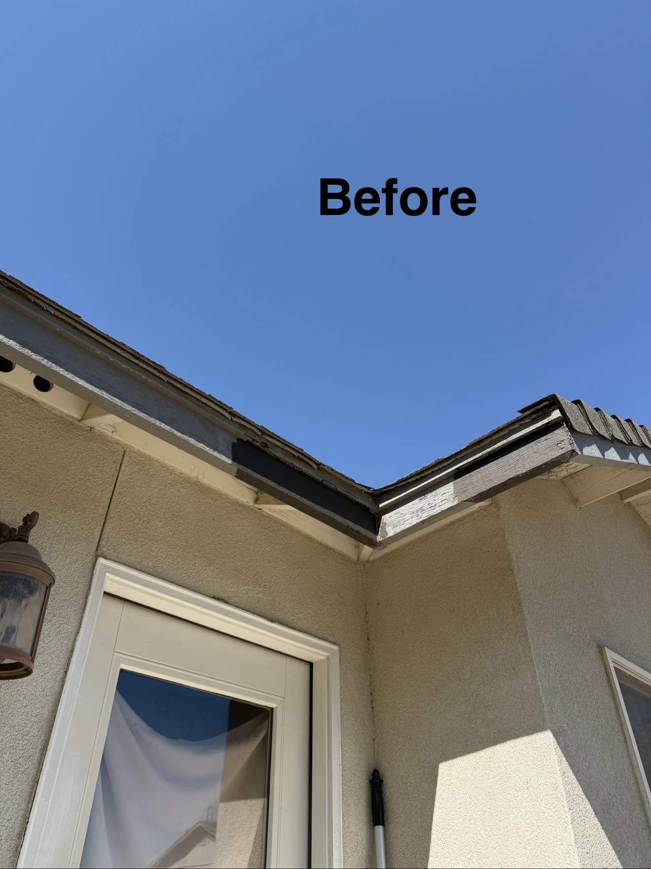Weathered eave corner before repainting