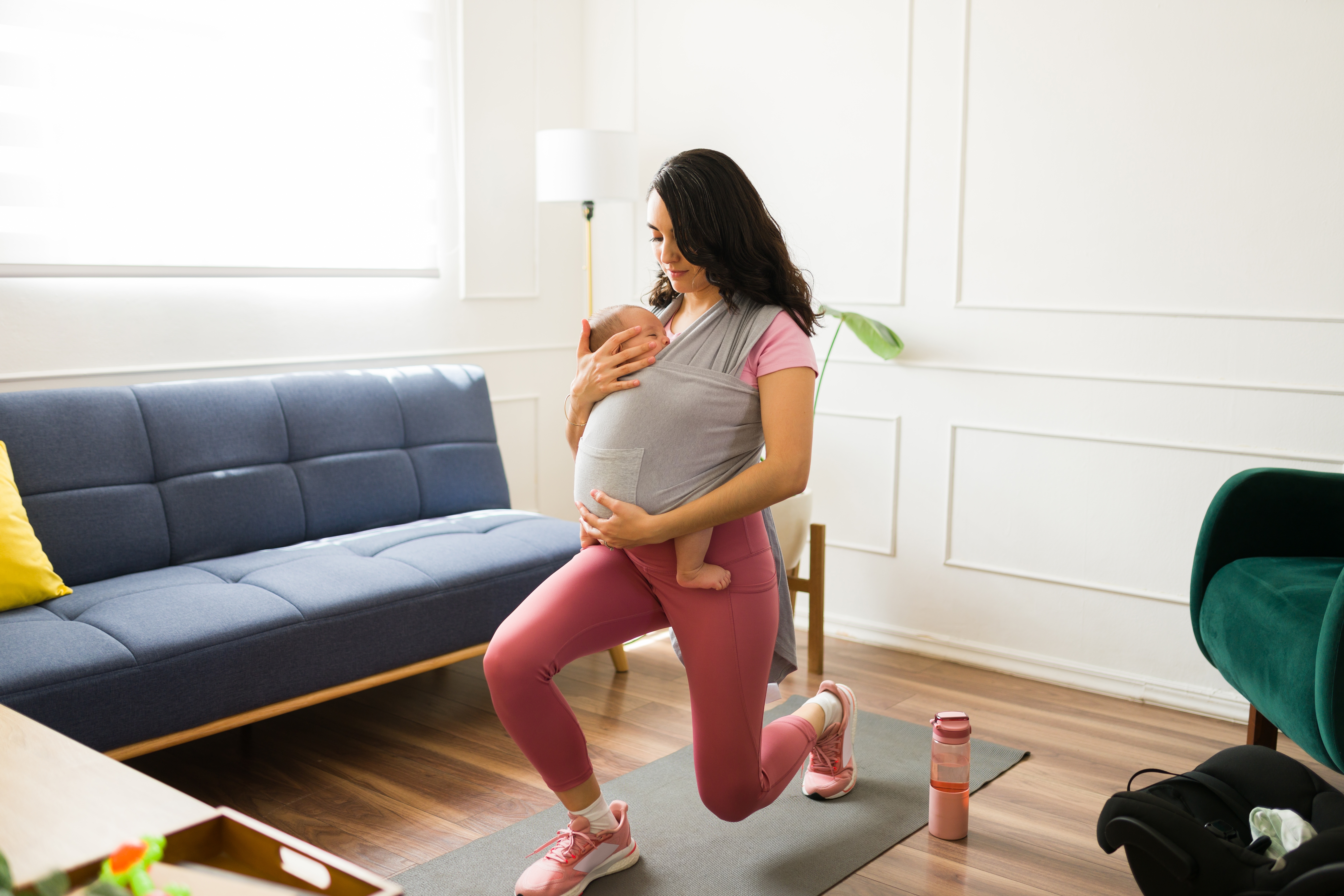 woman in black sleeveless dress lying on green grass field