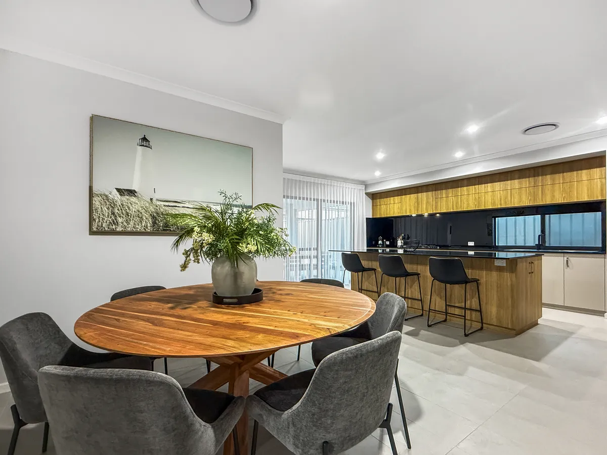 Shared dining and kitchen area at the supplied Meadow Springs property