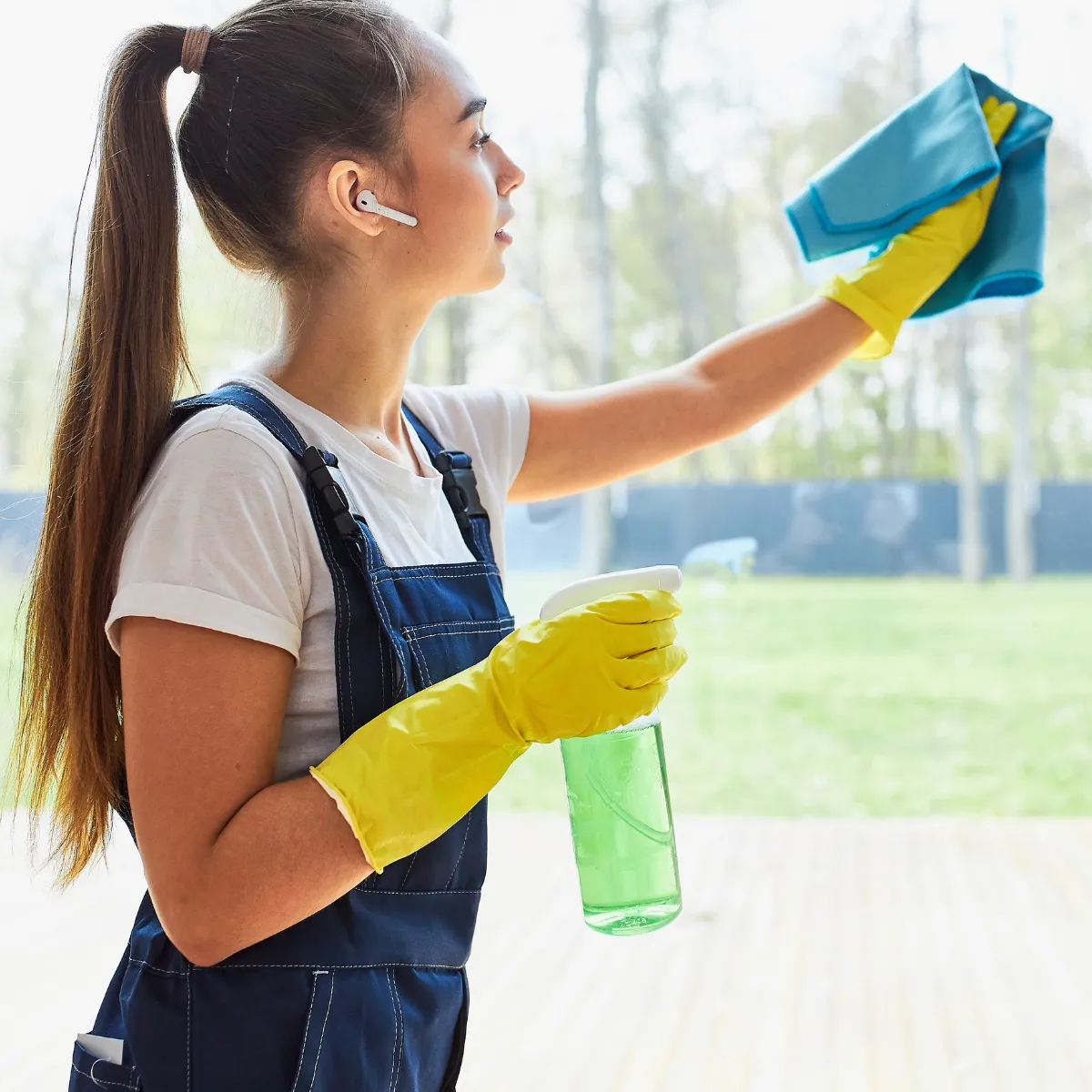 Cleaning team wiping windows in a residential apartment