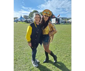 Picture of two people stood together on a field