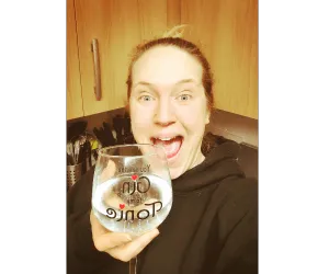Picture of Lisa - a white woman holding a glass