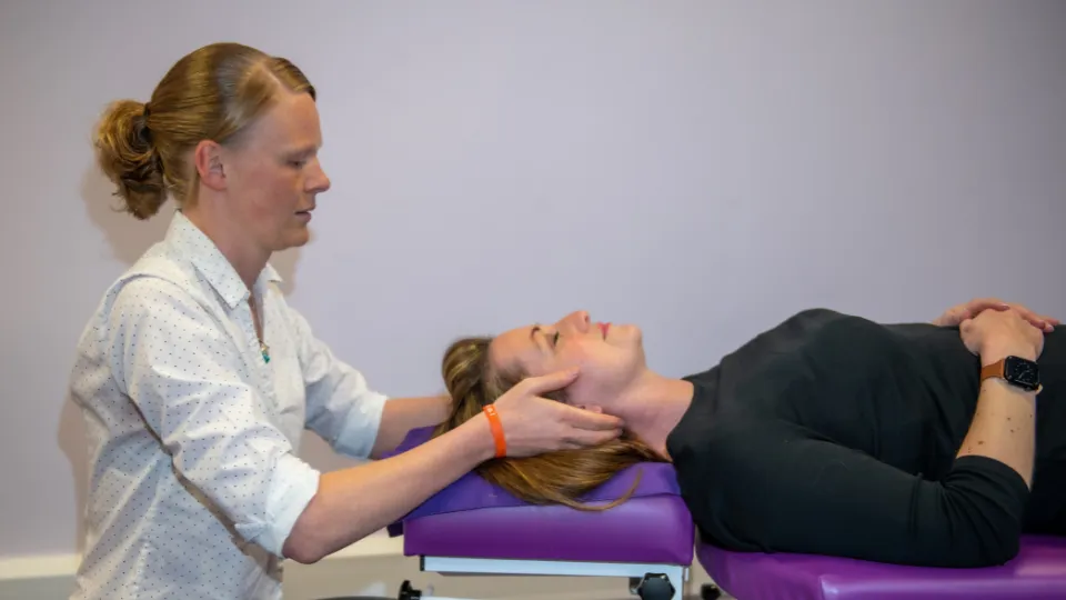 Chiropractor with patient