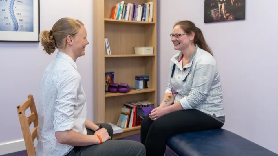 Chiropractor with patient