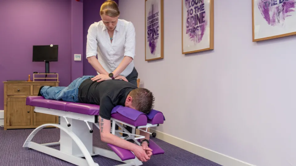 Chiropractor with patient