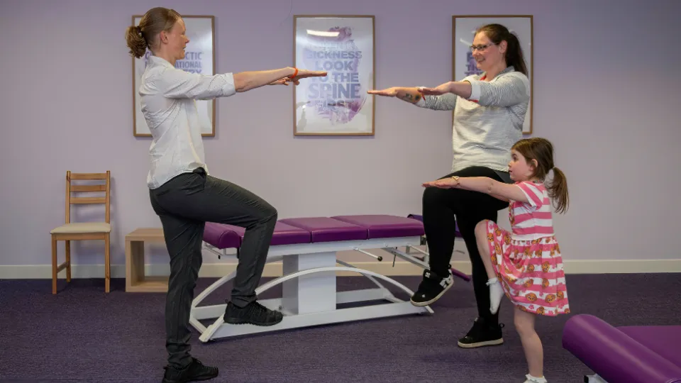 Chiropractor and patients kids 