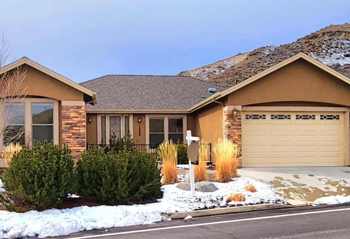Outdoor kitchen and covered deck in Silver Oak community