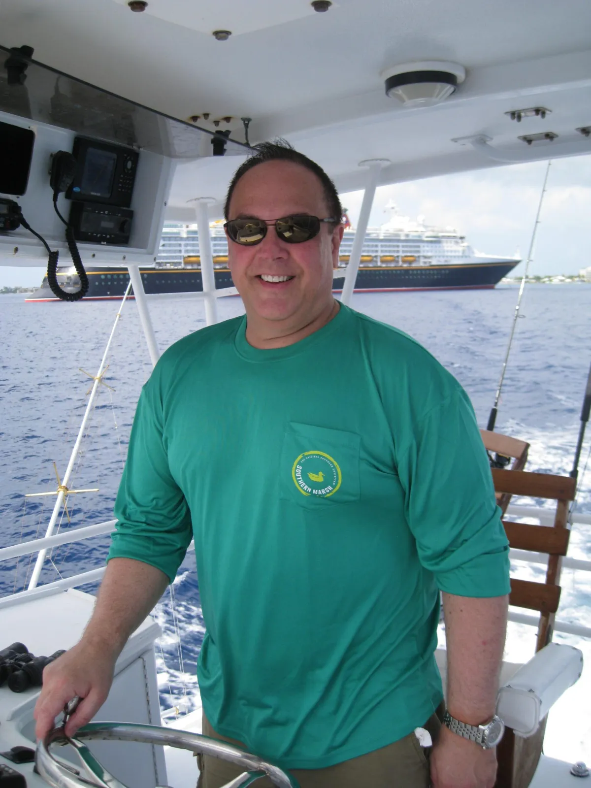 Picture of James McCabe at the helm of a 65ft  fishing boat.