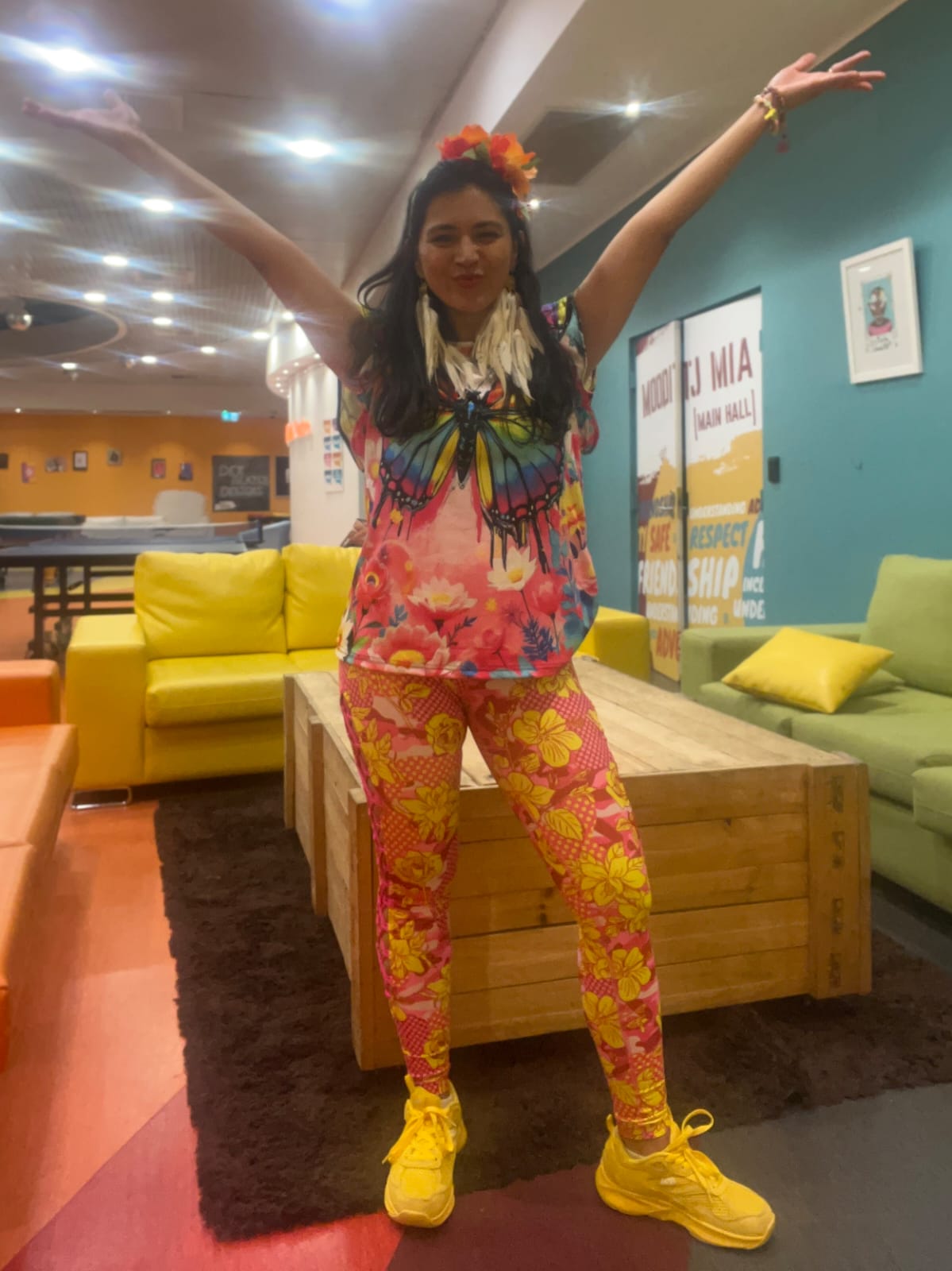 Instructor guiding participants through gentle Zumba steps in a bright, welcoming studio with chairs available.