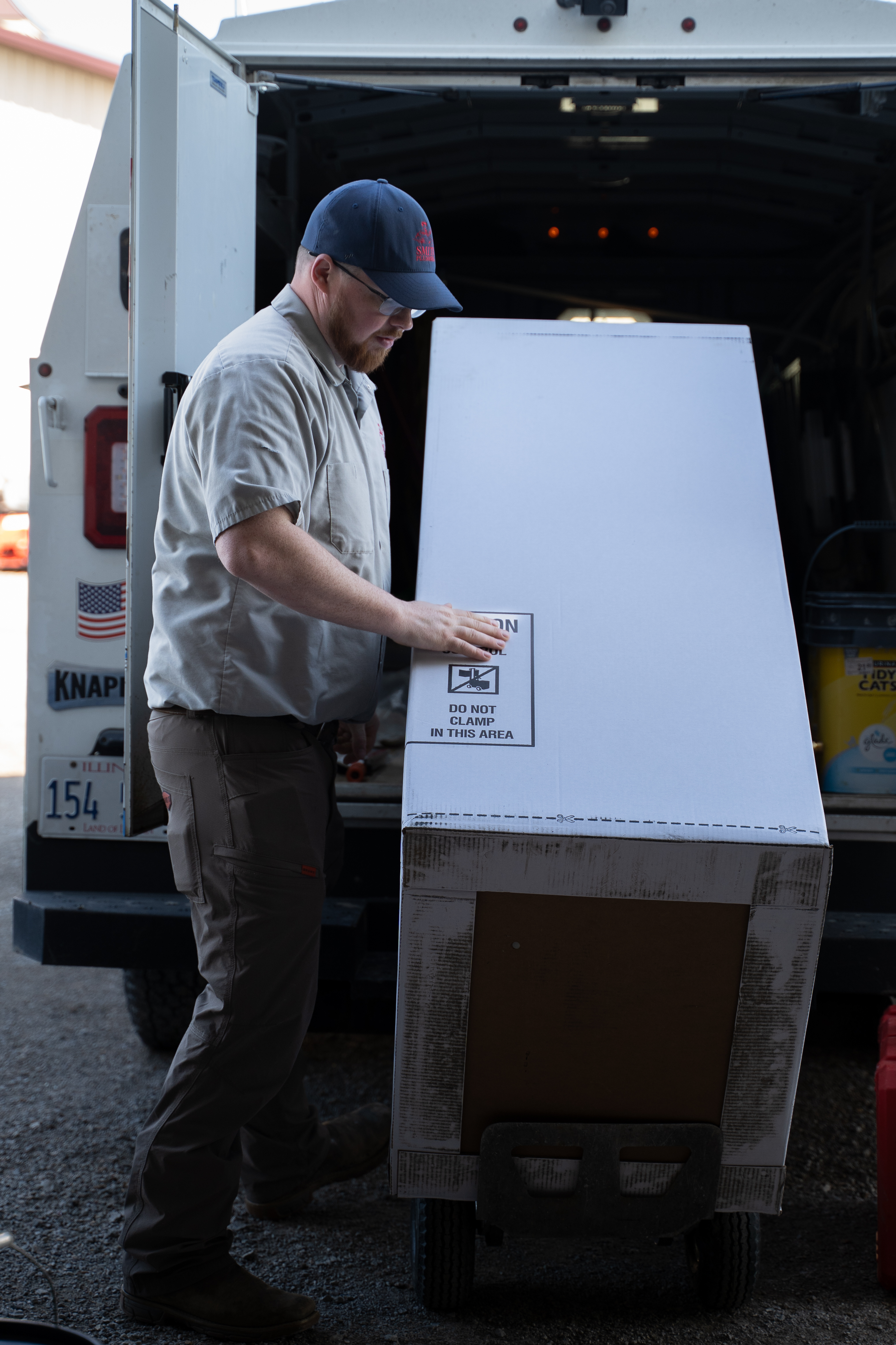 HVAC heating and cooling technician servicing equipment