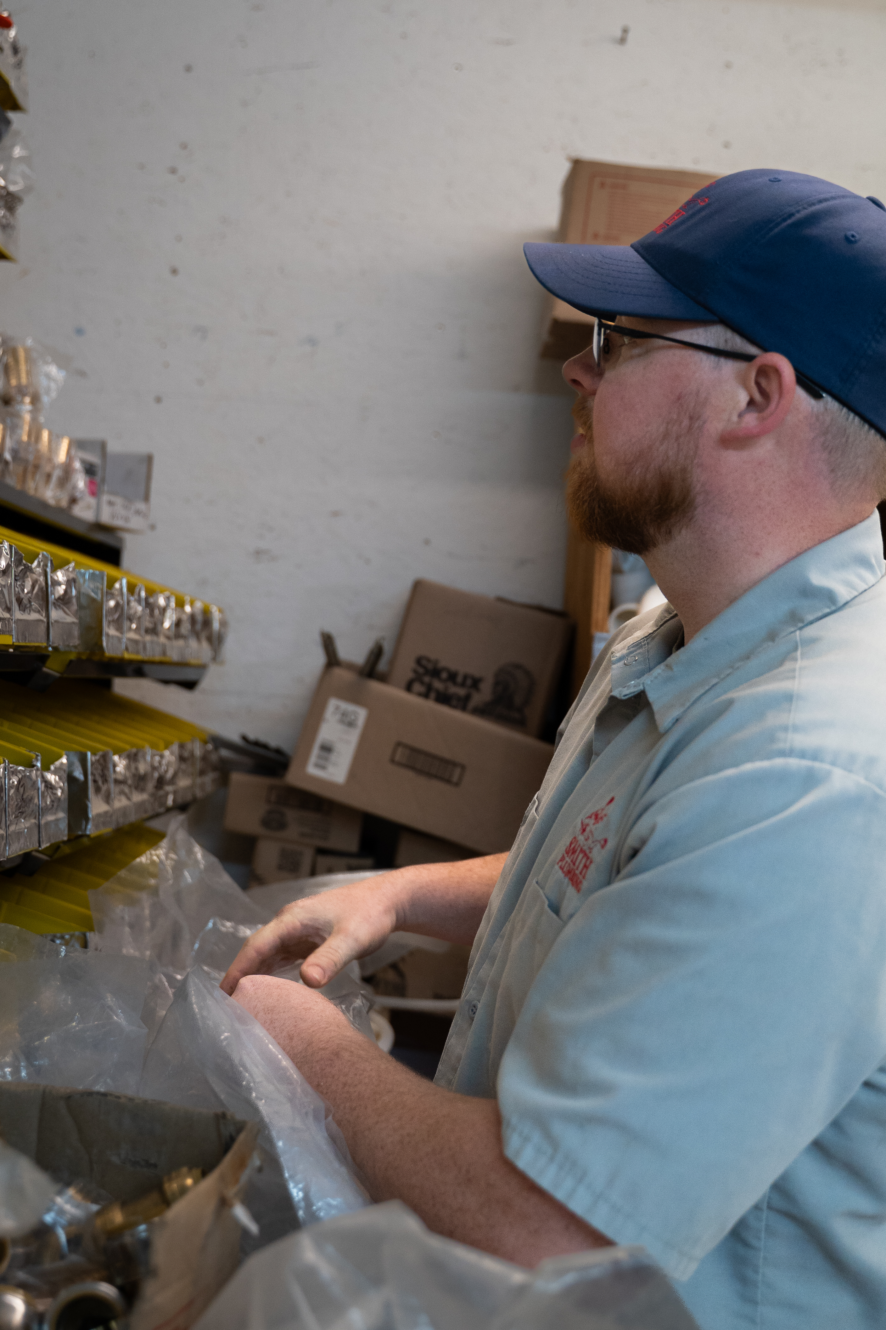 Professional plumbing technician performing service work