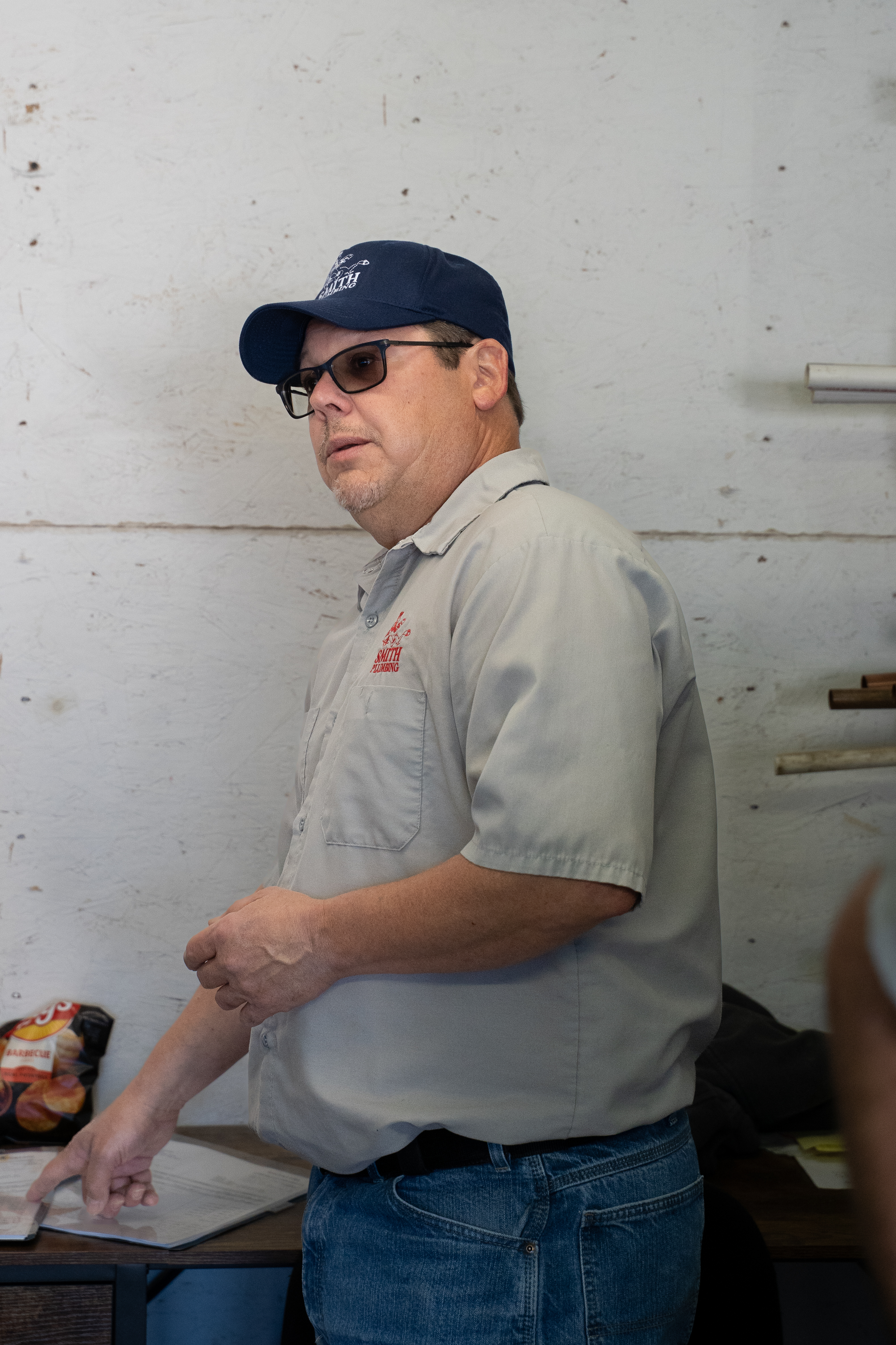 Professional plumbing technician performing service work