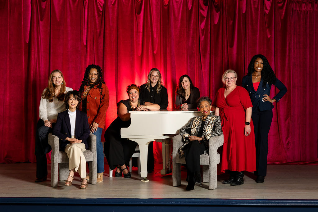 Group image of 2025 TWSS Columbia cast on and around a coach