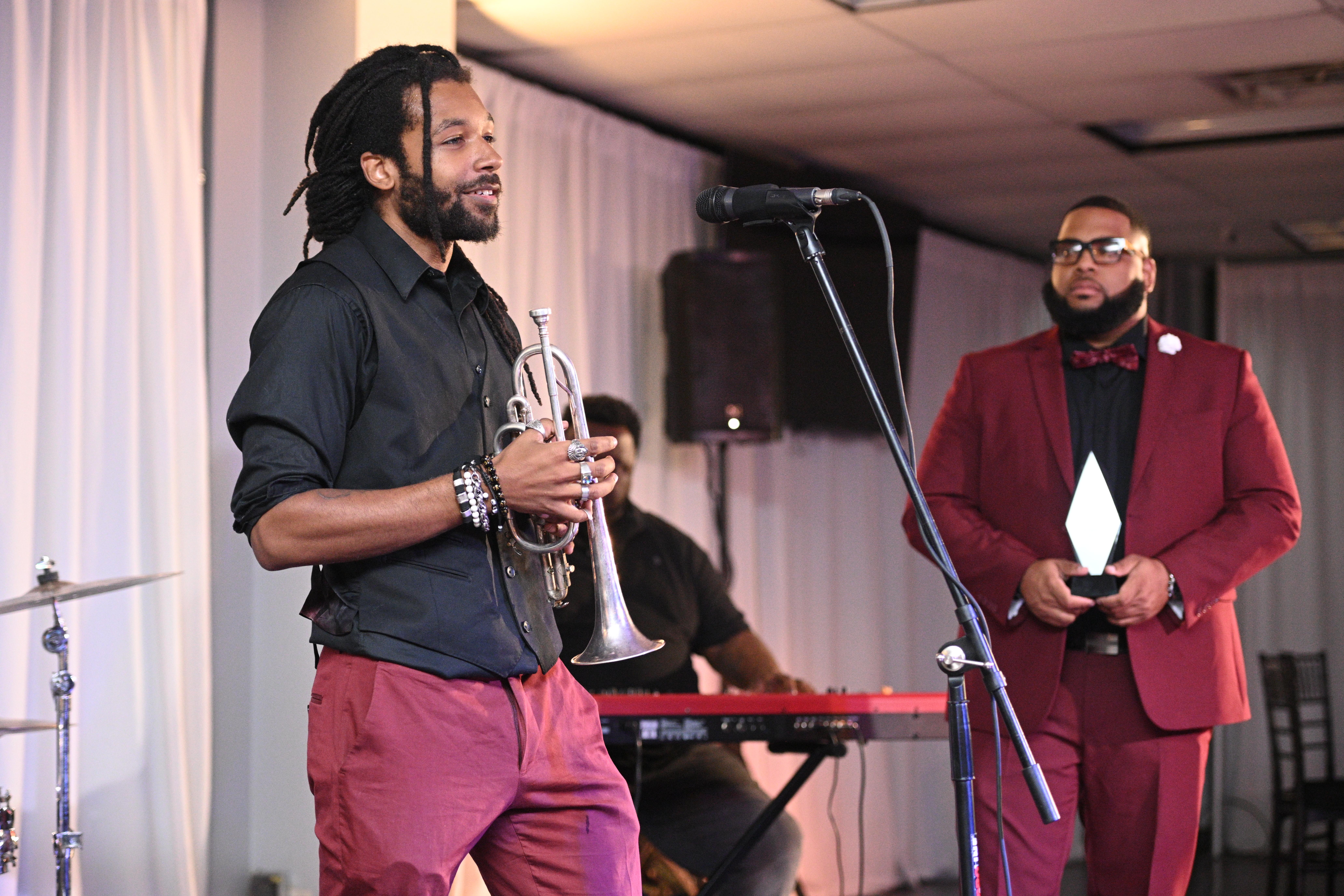 a table with paints and paint brushes