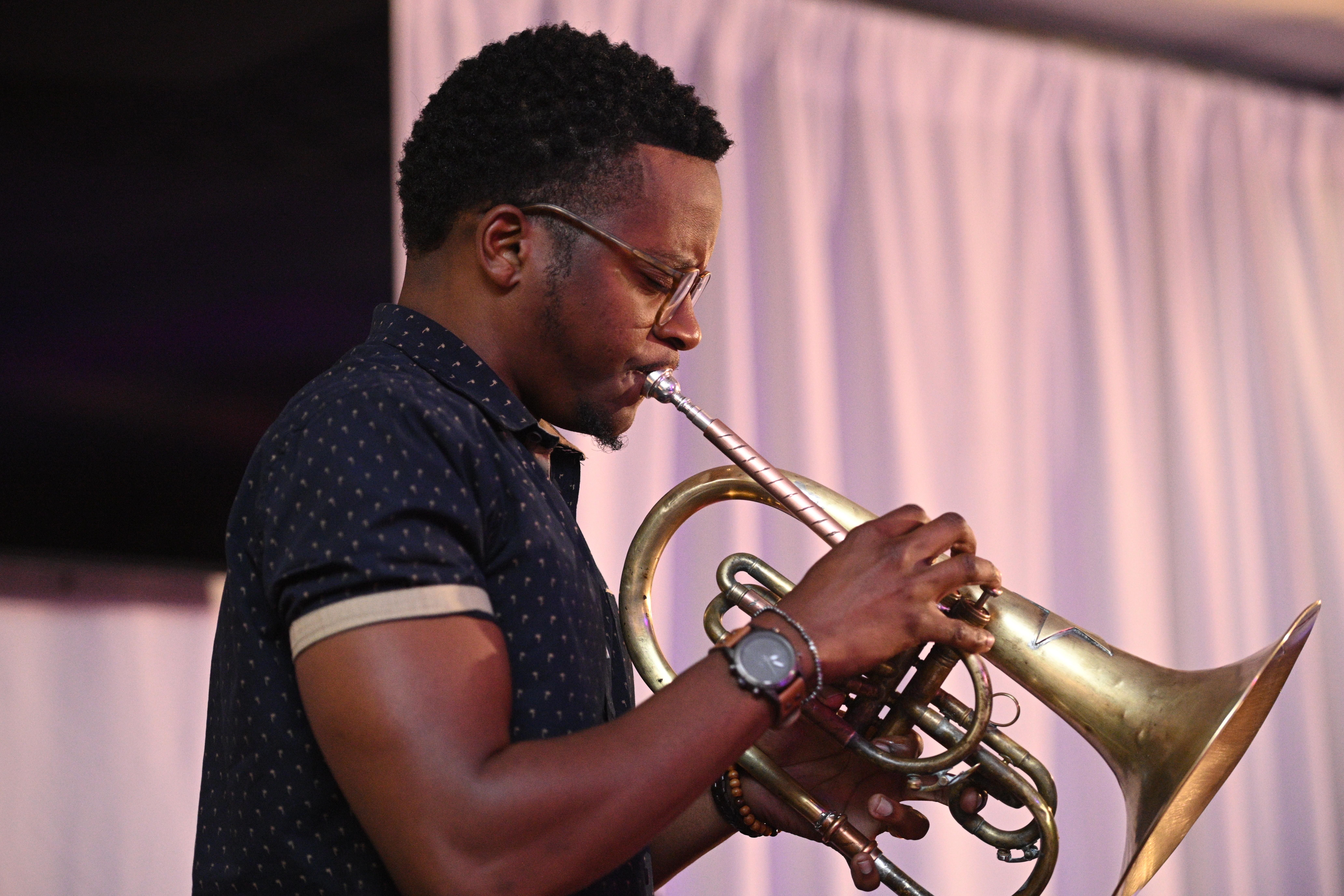 a pair of headphones sitting on top of a stand