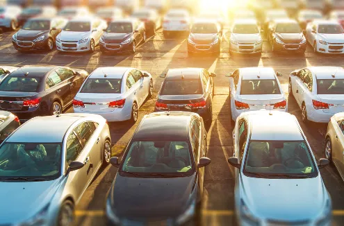 cars in a parking lot at sunset