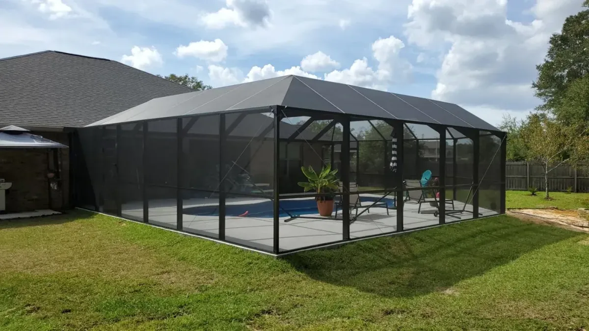 Finished bronze mansard pool enclosure built to match its engineered 3D design by Aluminum Building Systems in Lynn Haven, FL