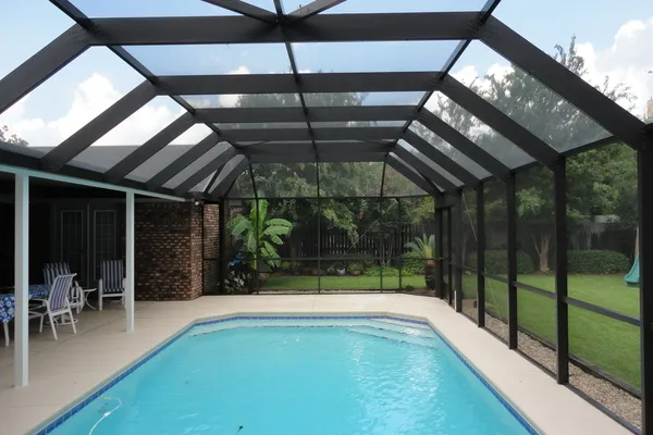 Finished pool enclosure by Aluminum Building Systems.