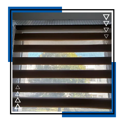 Custom zebra shades adding privacy and soft light in a bedroom