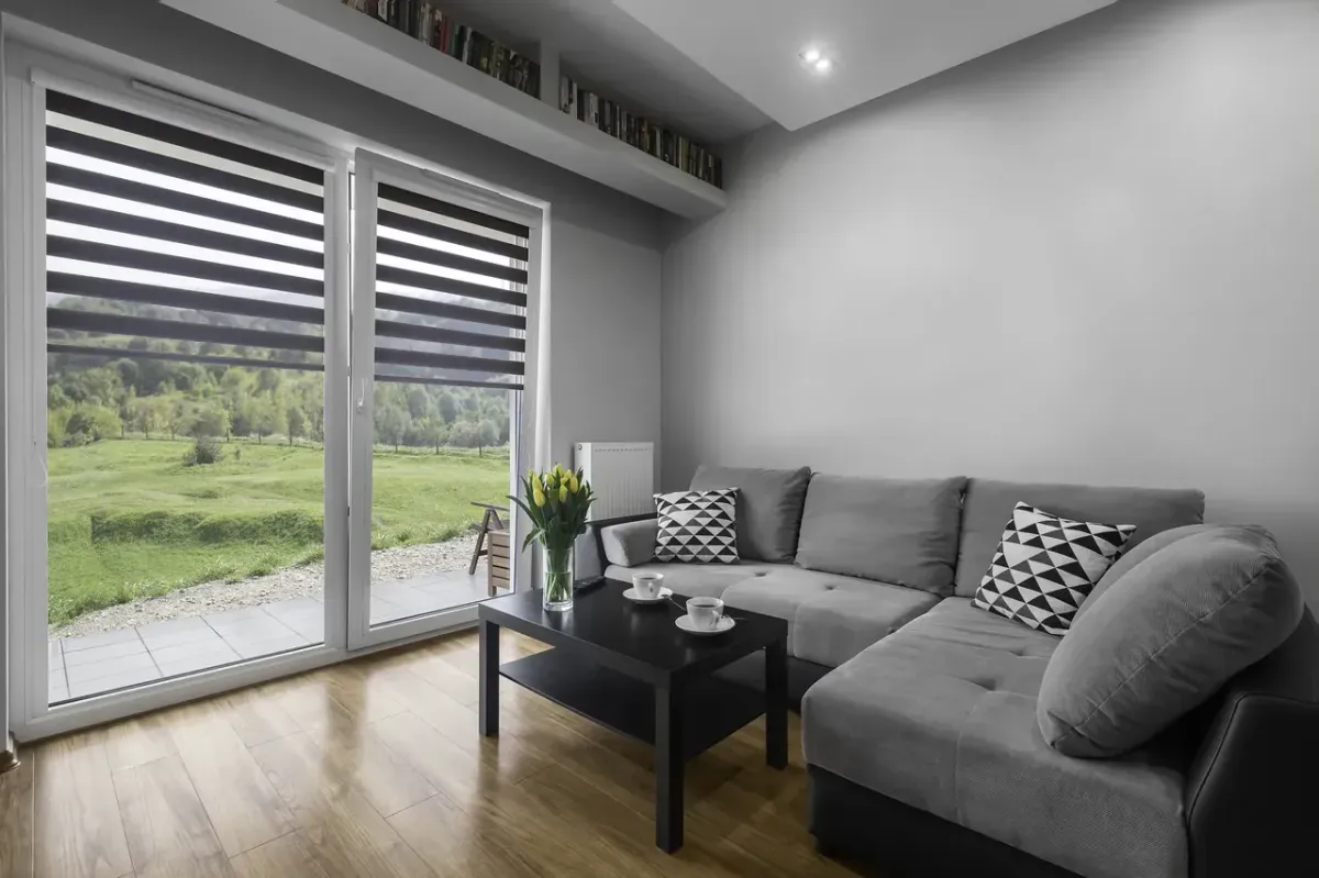 Modern zebra roller shades improving light control and comfort in a stylish home interior
