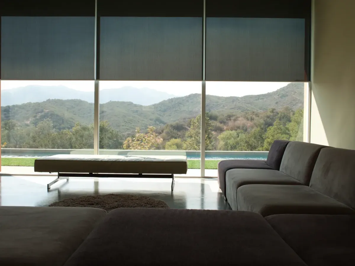 Light filtering roller shades adding privacy in a Stuart bedroom