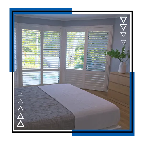 Plantation shutters in a bright Stuart, FL living room with clean white panels