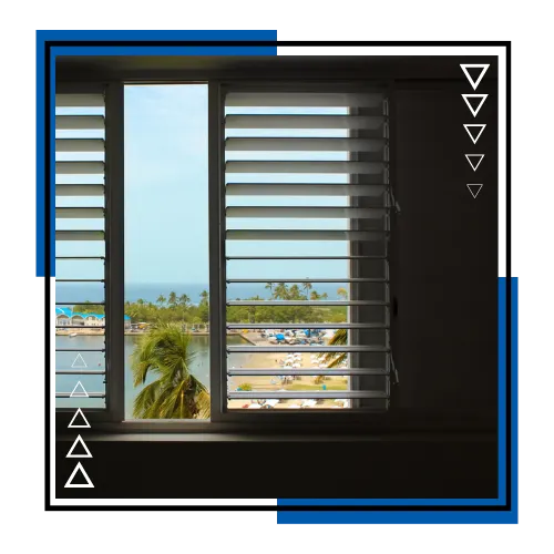 Custom plantation shutters in Stuart, FL installed in a cozy bedroom for privacy