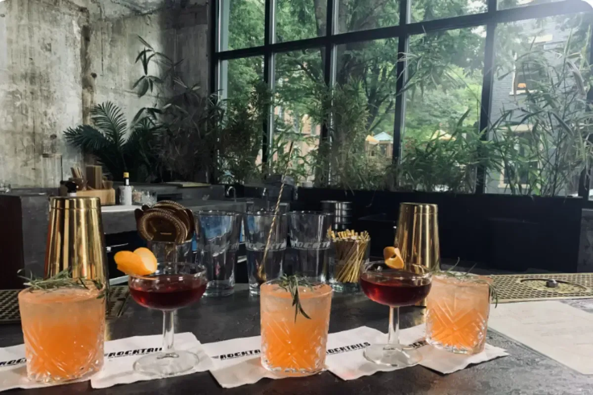Bars on Wheels craft cocktails arranged on bar counter at stylish indoor private event setup
