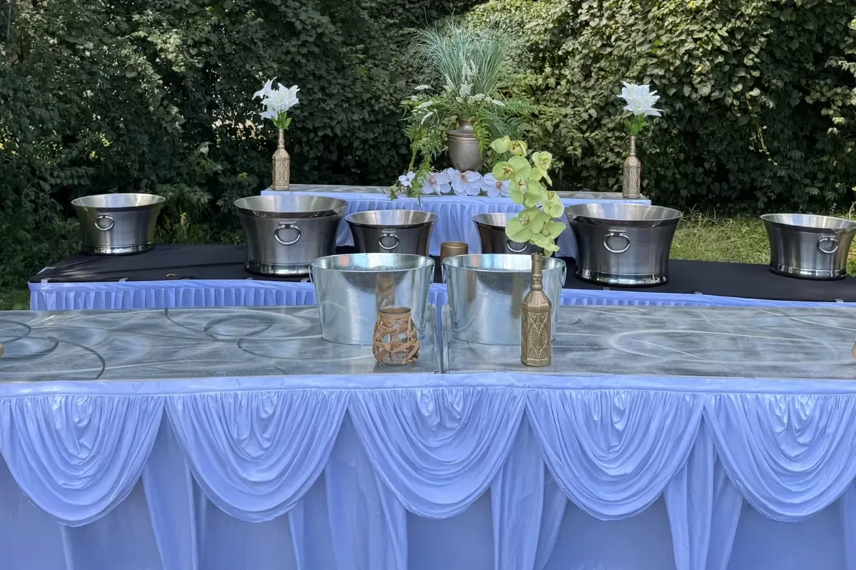 Bars on Wheels outdoor event bar setup with drink stations and floral decor for elegant wedding reception