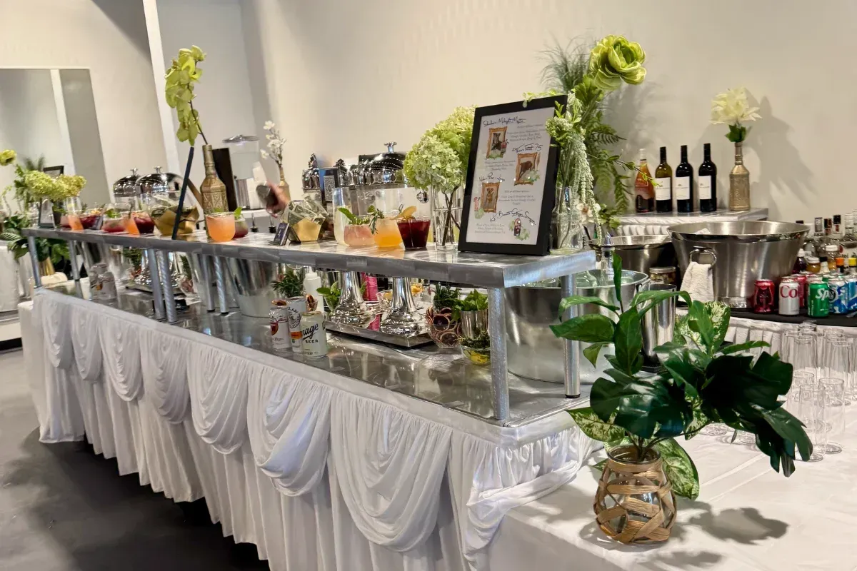Bars on Wheels stylish cocktail station with floral decor displayed at elegant wedding event bar s