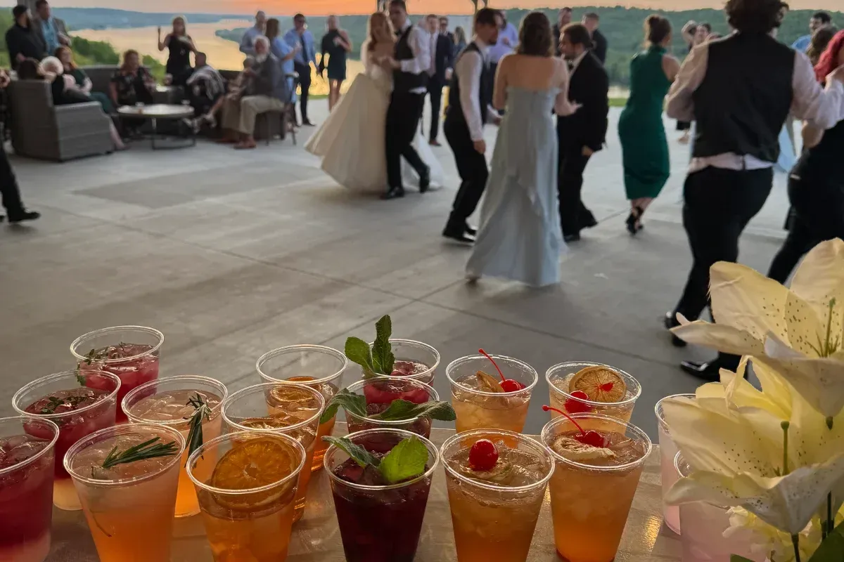 Bars on Wheels mobile bar setup with assorted drinks and cocktails at outdoor private party event
