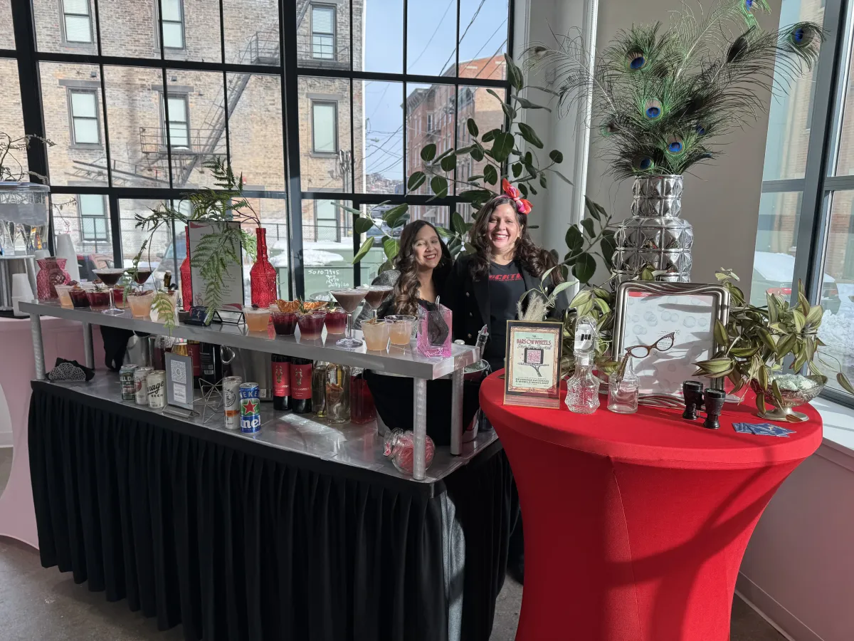 Corporate Mixology & Beverage Service Bars on Wheels cocktail bar setup with fresh garnishes and drinks displayed at elegant private event