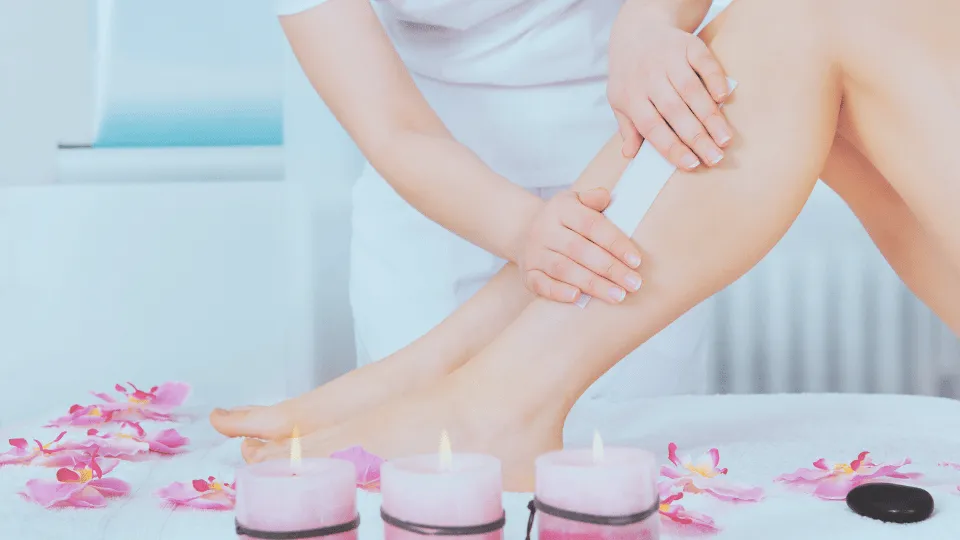 A woman's legs getting waxed
