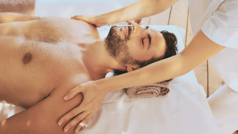 A man and woman receiving a couples massage