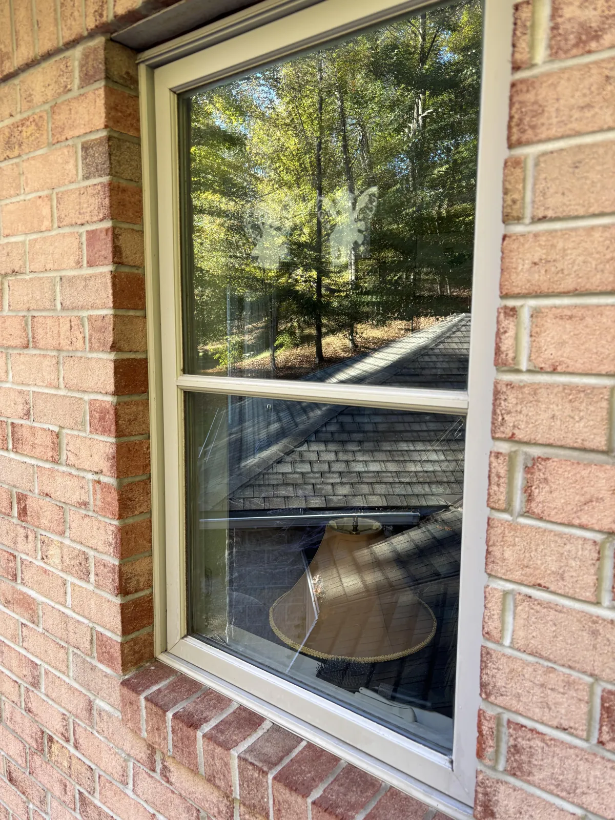 white framed glass window closed