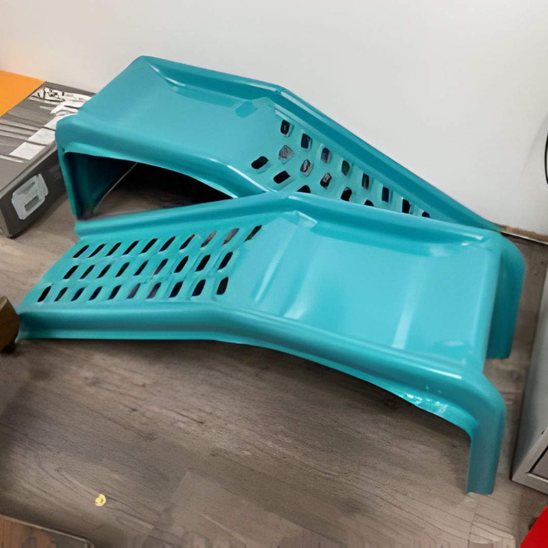 Two bright teal, possibly for vehicle maintenance, feature a perforated, non-slip surface and a glossy finish.