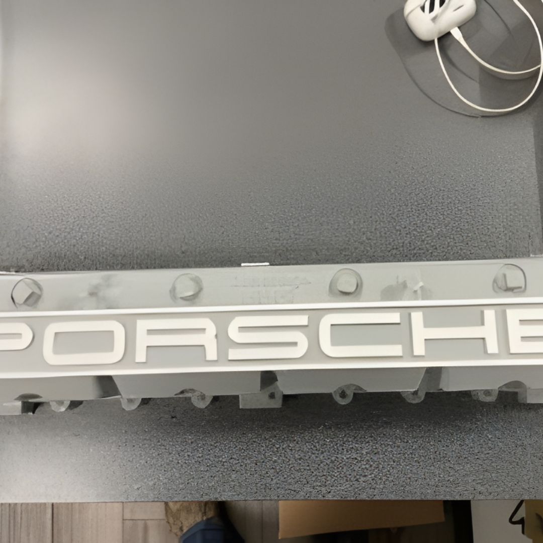 A close-up of a silver metal engine component