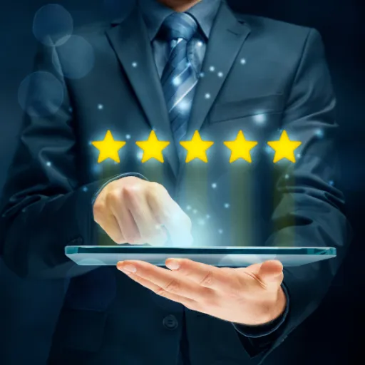 Business professional using a tablet to display five glowing stars, symbolizing positive reviews and reputation management.