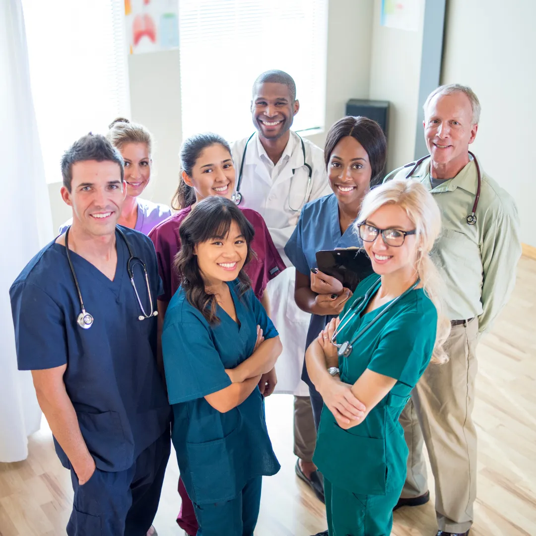 Couple working out in a gym, woman holding a dumbbell and focusing on her form, while man lifts a dumbbell behind her, emphasizing fitness and strength training.